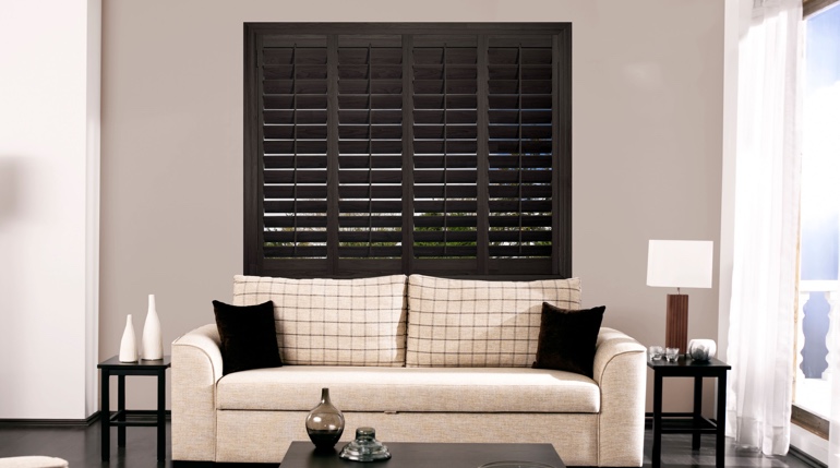 Jacksonville sunroom with stained wood shutters.